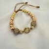 Pulsera San Benito Oro Rosa con Balines y Bola de Fuego Oro Laminado 18K | Fe y Elegancia